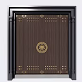 Dark Wooden Front Gate With Golden Circular Emblem Rivets And Black Frame