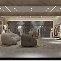 Modern Clothing Store Interior Design With Comfortable Sofa And Clothing Racks