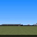 Modern Industrial Factory Building Exterior With Large Windows Glass Curtain Walls And Cars On Road