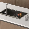 Modern Kitchen Sink With Faucet Water Flowing Drainer Fruits And Glass Cups On Countertop