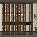 Traditional Wooden Folding Partition With Carved Lattice And Circular Decor In Interior With Green Plant