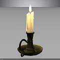 Burning White Candle On Decorative Metal Candlestick With Curved Handle And Tray
