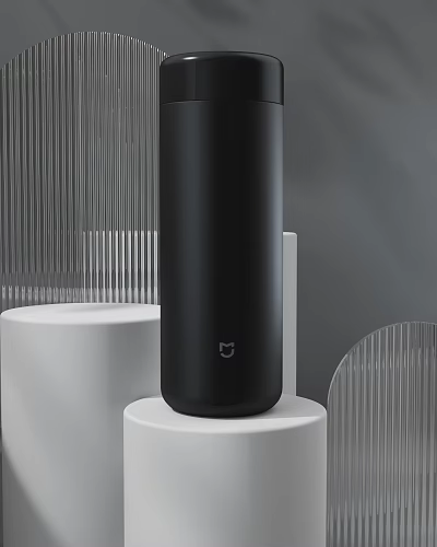 Sleek Black Mug With Modern Design And Brand Logo Placed On White Base 3d model