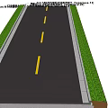 Well Designed Road Facilities Featuring Asphalt Pavement Yellow Center Lines Curb and Grass Verge