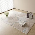 Square Beige Rug With Blue Circular Patterns On Wooden Floor Featuring White Flower Bouquet Magazines