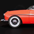 Red Vintage Convertible Car With Classic Chrome Grille And White Wall Tires