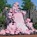 Floral Art Installation With Pink Cherry Blossoms Rocky Background And Green Trees