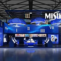 MiLine Blue Exhibition Booth With Multiple Zones Display Counters And Hanging Lights