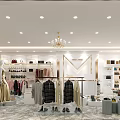 Stylish Clothing Store Interior With Chandelier Fan Racks Clothes White Display Tables And Marble Flooring