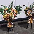 Floral Decorative Arrangement With Brown Paper Wrapped Bouquets Orange Ribbon On Black Stand White Wall