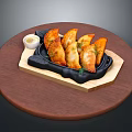 Crispy Fried Dumplings Served On Black Iron Plate With Dipping Sauce And Dill