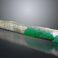 Ancient Textured Long Artifact With Green Patina And Weathered Surface
