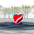 Heart Shaped Metal Sculpture With Red Pink Blue Curves In Water Pool And Metal Fence