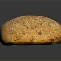 Fresh Round Multigrain Bread Loaf Topped With Sesame Flax And Sunflower Seeds