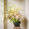 Pink And White Hydrangea Flowers In Black Marble Vase On Wooden Stand With Green Leaves