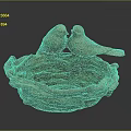 Two Bird Sculptures Perched On Woven Bird Nest Against Dark Background