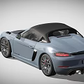 Blue Convertible Sports Car With Black Roof Red Seats And Sporty Design