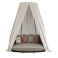 Stylish Round Bed With Beige Canopy And Colorful Decorative Pillows In Cozy Setting