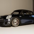 Shiny Black Sporty Compact Car With Alloy Wheels And Front Grille Design