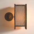 Traditional Wall Lamp With Carved Metal Base And Paper Shade Emitting Warm Light