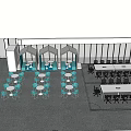 Office Desks In Open Workspace With Round And Long Tables And Black Chairs