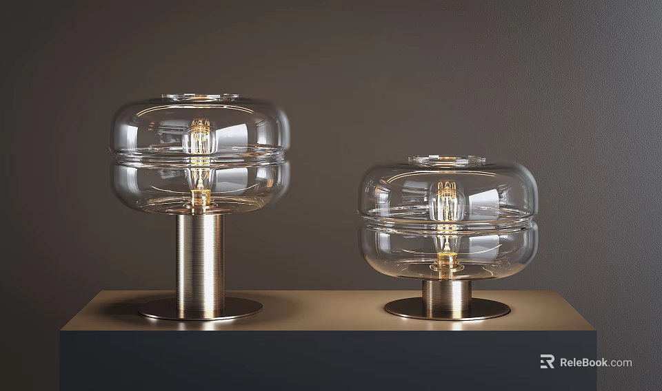 Two Modern Table Lamps With Clear Glass Shades And Sleek Metal Bases 3d model 