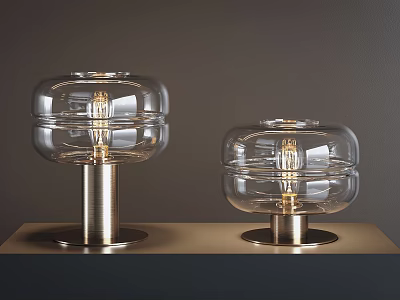 Two Modern Table Lamps With Clear Glass Shades And Sleek Metal Bases 3d model