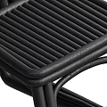 Modern Black Rattan Chair Featuring Woven Details And Ergonomic Structure For Home Use