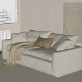Light Gray Two Seater Sofa With Soft Cushions And Throw Blanket In Modern Minimalist Room