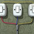 Three White Switch Panels Installed with Red Blue Yellow Wires on Green Patterned Wall 3d model