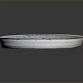 Light Gray Ceramic Plate With Cracked Surface And Intricate Central Carvings