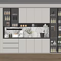 Modern Wine Cabinet With White Cabinets Marble Countertop Wine Bottles Glassware And Green Plants