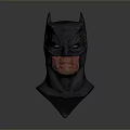 Man Wearing Detailed Batman Mask with Fierce Expression and Dark Design