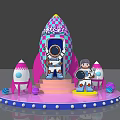 Cotton Candy Planet Themed Rocket Display With Astronauts And Small Rockets On Pink Platform