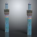 Two Ornate Towers Featuring Blue Green Geometric Patterns With Domed Tops And Decorative Balconies
