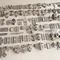 Various Metal Hardware Components Including Hinges Latches And Connectors Displayed On Wooden Surface