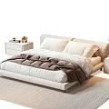 Light Modern Double Bed With Pillows Brown Blanket Nightstands Table Lamp And Green Plant