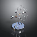 Modern Metal Sculpture With Spherical Elements And Wire Frame On Circular Reflective Base 3d model
