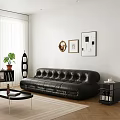 Modern Black Leather Tufted Sofa And Coffee Table With Wall Art And Plants