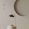 Modern Minimalist Table Lamp With Light Gray Wall And Circular Decoration For Calm Ambiance