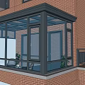 Glass Sunroom Attached To Red Brick Building With Black Frame And Glass Windows
