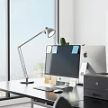 Modern Office Desk Setup With Computer Monitor Desk Lamp Sticky Notes Printer And Potted Plant