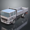 Silver UN Truck Front View With Open Cargo Bed And Reflective Surface