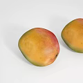 Two Fresh Mangoes With Yellow And Red Skin On White Background