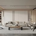 Modern Living Room With Neutral Sofa Coffee Table Patterned Rug And Indoor Plant