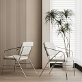 Modern White Accent Chairs With Metal Frame Against Vertical Striped Wall Blinds And Palm Plant