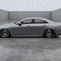 Silver Mercedes Sleek Sedan With Alloy Wheels In Modern Indoor Concrete Space