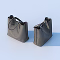 Two Gray Handbags with Black Handles on Light Background Textured Design