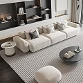 Modern Cream Sofa And Round Black Coffee Table Set With Striped Rug And Footstool