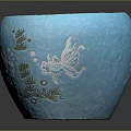 Succulent Plant In Blue Ceramic Pot With Fish And Seaweed Patterns And Small Pebbles